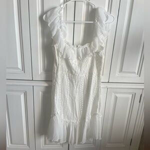 Pretty white lacy mini dress. Fun flounce! Beautiful!